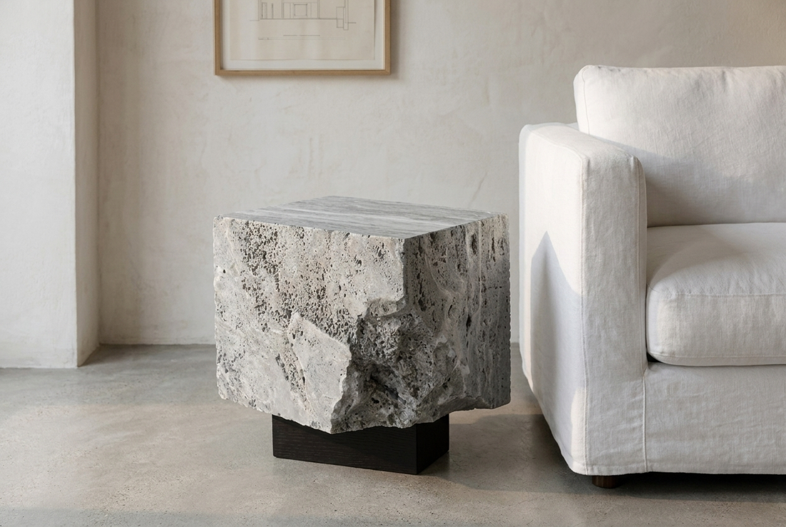grey travertine side table in minimal architect interior — contemporary stone furniture