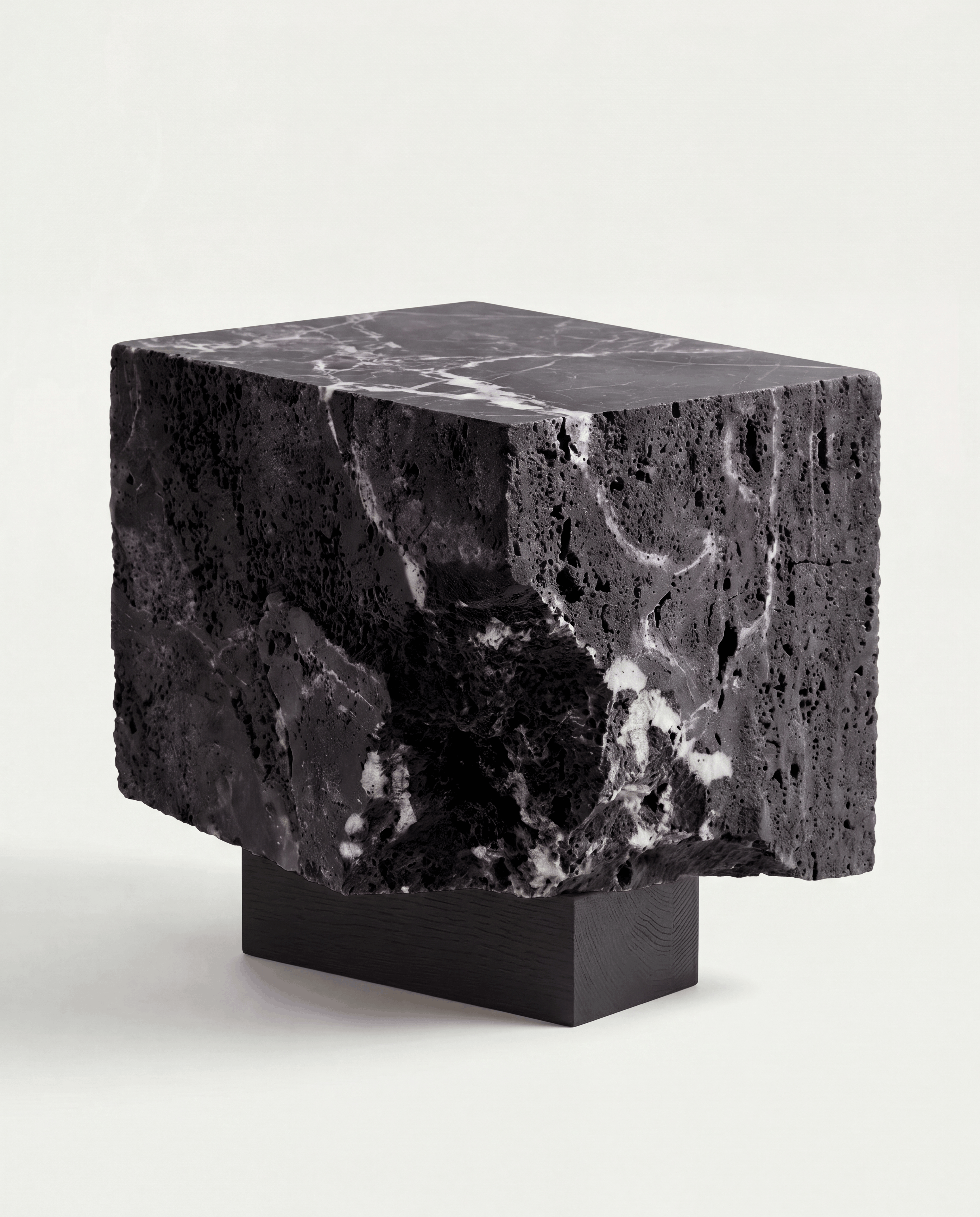 The Roman Plinth Calacatta Black – dark travertine with calcite vein, dramatic finish