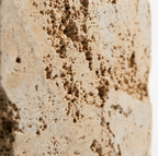 Beige travertine close-up — natural geological variation