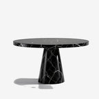 The Disc Coffee Table — Front view, circular Nero Marquina disc top and tapered base