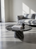The Disc Coffee Table — Lifestyle view in minimal interior, architectural morning light
