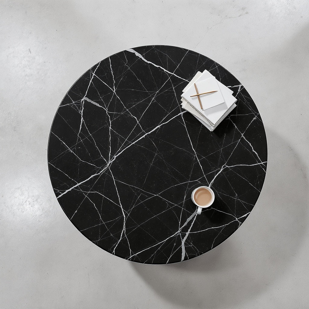 The Disc Coffee Table — Overhead view, perfect circle of Nero Marquina marble