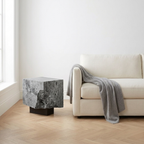 The Roman Plinth Grey Travertine — minimalist interior lifestyle, natural linen sofa