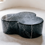 The Cloud Coffee Table in black biomorphic marble — double-lobe organic silhouette, architectural object