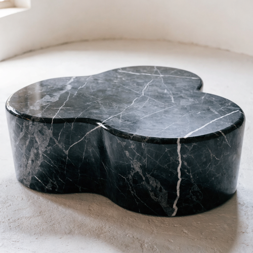 The Cloud Coffee Table in black biomorphic marble — double-lobe organic silhouette, architectural object