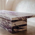 The Viola Dining Table in Italian Calacatta Viola marble — dramatic purple and burgundy veining, stacked slab base