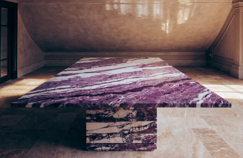 The Viola Dining Table in voluminous dining room — polished plaster ceiling, warm stone floor, Italian villa