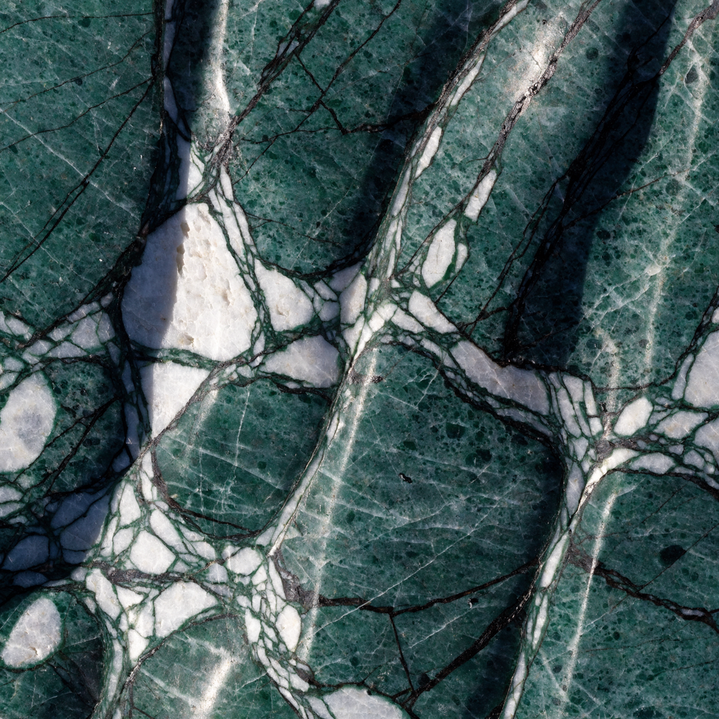 Amazon Green marble surface detail — deep green serpentinite, white and black mineral vein networks