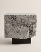 The Roman Plinth Beige Travertine – lifestyle render, warm interior, natural stone side table