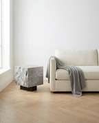 The Roman Plinth Red Travertine – iron-oxide travertine, lifestyle render, made to order
